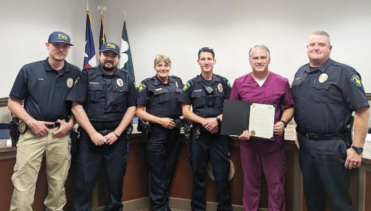 Mayor Pro Tem Sammy Moore presents a proclamation to the Dublin Police Department for the recognition of National Police Week, which is being held May 12-18. From left is Officer Garrett Collins, Officer Cody Cook, Detective Nanci Wilson, Officer Quinten Sells, Council member Sammy Moore and Police Chief Cameron Ray. Paul Gaudette | Citizen staff photo
