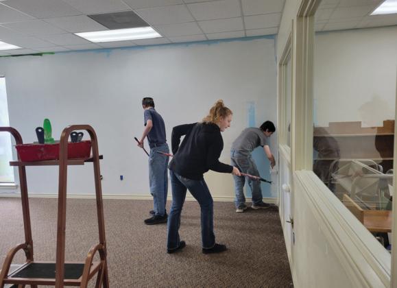 Volunteers have been integral to the success of the library’s latest renovation. Here, teens aid in painting the old children’s area which will become the new teen area in the Dublin Public Library. Wyndi Veigel-Gaudette | Citizen staff photo