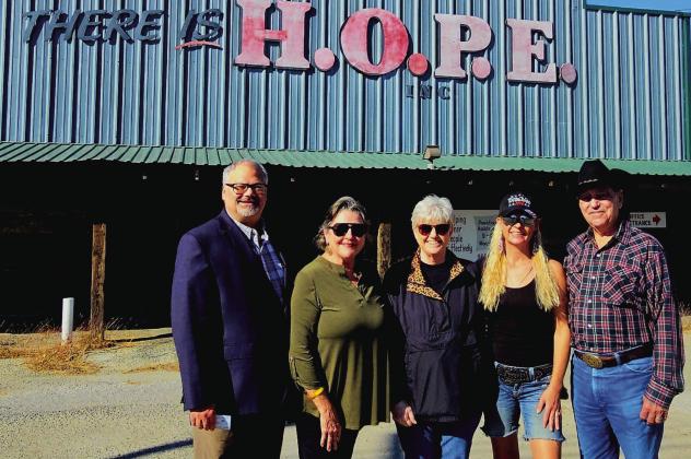 From left, Moumin Quazi, Erath County Democratic Party Chair, Pat Schipper, Erath County Democratic Party, Lisa Scott, Hope Inc. director, Heather Anderson, second vice chair of Erath County Republican Party and Dave Washam Erath County Republican Party Chair all join together outside HOPE Inc. as both political parties join forces across the aisle to combat hunger in the county with donations to Meals on Wheels, food pantries and food banks. Courtesy photo