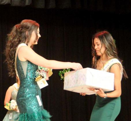Senior Madison Turley, who sold the most tickets for Miss Dublin 2024, draws a winning raffle ticket from a box. The senior was also second runner up. Wyndi Veigel-Gaudette | Citizen staff photo