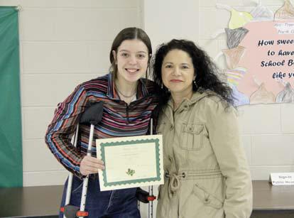 Academic Scholars Kevin Herrera (not pictured) and Madison Turley. Presented by High School Principal Norma Briseno.
