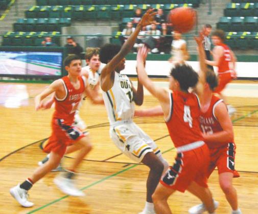Dublin Lion Dalan Rasberry leaps to shoot the ball as a host of Eastland Mavericks surround him during Friday’s 60-50 home victory Friday. The Lions were 7-3 in district heading into Tuesday’s games after also beating the Comanche Indians 74-40 on Jan. 26. Paul Gaudette | Citizen staff photo