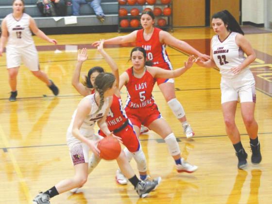 Lingleville Lady Cardinal Brena Gage looks to pass the ball to teammate Jaden Vandenberg during Friday’s 54-29 home victory over Gorman. This win followed a 51-30 loss to Huckabay on Jan. 26. Sara Gann | Citizen staff photo