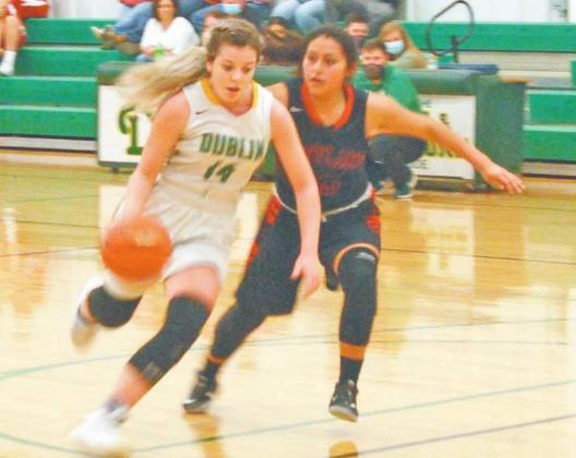 JV Lady Lion Madison Turley edges past Eastland defense in Friday’s game on the home court. The game resulted in a loss for the JV Lady Lions. Paul Gaudette | Citizen staff photo