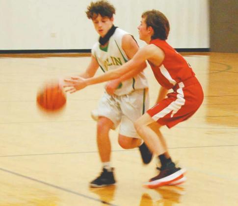 JV Freshman Lion Cameron Patton shrugs off to Eastland defense as he moves the ball up the court in Friday’s home game. The freshmen Lions won 57 to 37. Paul Gaudette | Citizen staff photo