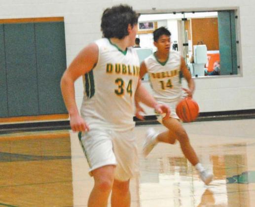 JV Lion Joel Escobar dribbles the ball up court with support from Cooper Pickett during Friday’s home game against Eastland which resulted in an overtime victory for the JV Lions. Paul Gaudette | Citizen staff photo