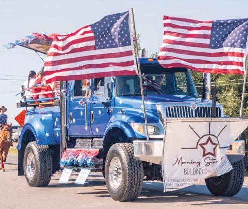 A patriotically adorned truck for Morning Star Ranch shows off their supporters followed by riders on horseback. Morning Star Ranch is a safe, Christian experience where children can learn life skills by opening their hearts to horses located outside Dublin. Jayden Meador | Citizen staff photo