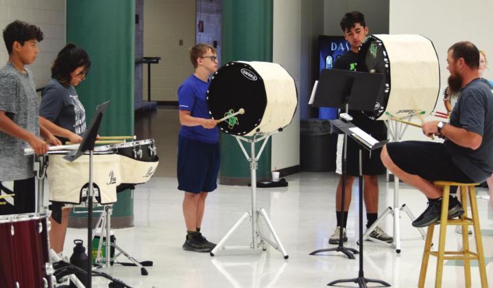 Sound of Dublin director Ronny Luedke (above, seated) leads band members in practice Monday as they prepare for the 2021-2022 season. A back-to-school band boosters meeting will be held Aug. 9 at 7 p.m. followed by free burgers and chips for those in attendance. Stephanie Sojuorner | submitted photos