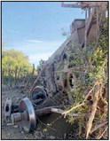 Train wheels are shoved through a fence. John Forson | Sumitted photo