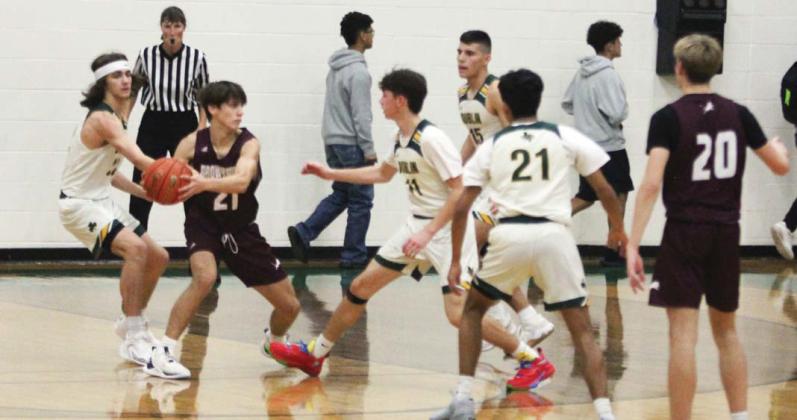 Dublin Lions attempt to wrestle the ball away from Brownwood offense during their first game of the Dublin Athletic Booster Club Tournament Nov. 30. Paul Gaudette | Citizen staff photo