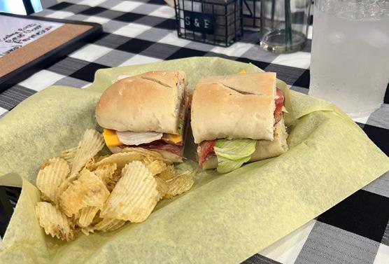 Above, a sandwich and chips are displayed at Wich Kids. Below, a homemade loaf of sourdough bread waits to be sliced. Courtesy photos