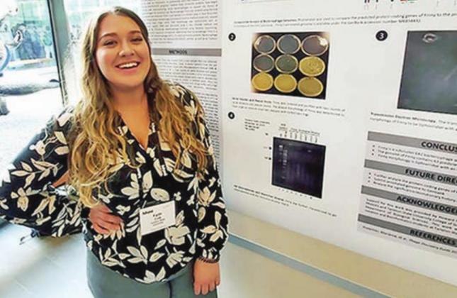 Tarleton student Faith Cox poses next to a presentation during the recent Baylor University Heart of Texas Undergraduate Research Conference held in Waco. | submitted photo