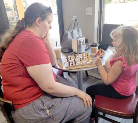 Two sisters enjoy time at Blackjack’s in downtown Dublin playing chess together while having beverages. Monday through Friday, the eatery is offering Happy Hour lattes for the summer from 3-5 p.m. Wyndi Veigel | Citizen staff photo