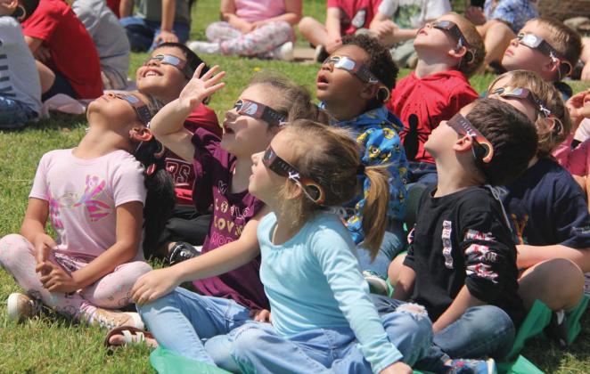 Dublin elementary students express awe and delight as they watch the total solar eclipse from the playground Monday, April 8. For more photos see the Dublin Citizen Facebook page. Wyndi Veigel-Gaudette | Citizen staff photo