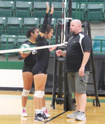 Senior Emma Vargas and Sophomore Adriana Stewart attempt to intimidate Athletic Booster Club President Ryan Mitchell before the start of the alumni vs Lady Lions games Tuesday, Aug. 20. The alumni teams beat both JV Green and Gold but fell (despite some creative scoring) to the Varsity Lady Lions. Below, the alumni team gathers to take on the Lady Lions. For full story see B1. Paul Gaudette | Citizen staff photos