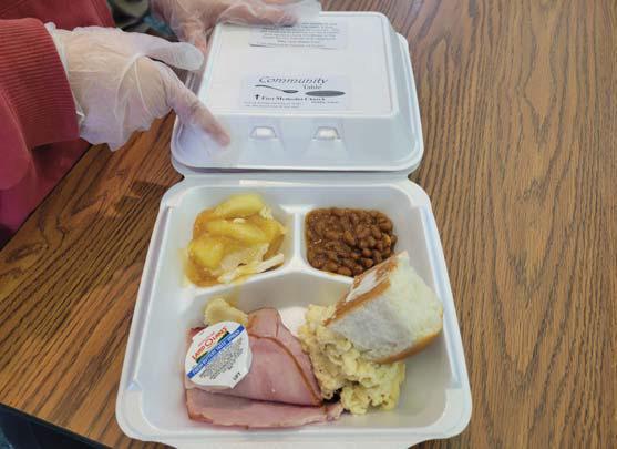 A delicious meal of ham, mac and cheese, baked beans, a roll and apple cobbler wss served at the final Community Table. Wyndi Veigel-Gaudette | Citizen staff photo