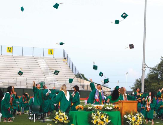 Dublin Graduates throw their hats in the air after commencement ceremonies Friday, May 23. Below, Lingleville seniors present roses to parents, friends and teachers to show how much they mean to them during commencement ceremonies Friday, May 23. For more photos see The Dublin Citizen Facebook page. Paul and Wyndi Gaudette | Citizen staff photo