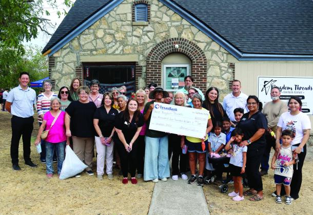 Texas Bank presents a $2,500 check to aid Kingdom Threads, an arm of First Baptist Church of Dublin that provides free clothes, shoes, toys and many other essential items to the community. Paul Gaudette | Citizen staff photo