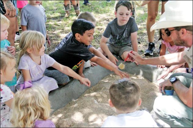 Kids of all ages enjoy digging into some dino fun at the Dublin Public Library Thursday, June 27 with Park Rangers from Dinosaur Valley State Park in Glen Rose. Students and adults alike got to hear about fossils found at the park, unearth some fossils outside and enjoy some popsicles courtesy of library staff. For more photos see the Dublin Citizen Facebook page. Reese Keeling I Citizen staff photo