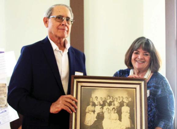 Wyndi Veigel | Citizen staff photo James Akard and his sister Elouise O’ Dannon hold a photo of the 1903 Woman’s Thursday Club of Dublin in which their great grandmother, Mrs. W.C. Akard, was a part of and served as president. She is located in the photo in the second row, on the left.