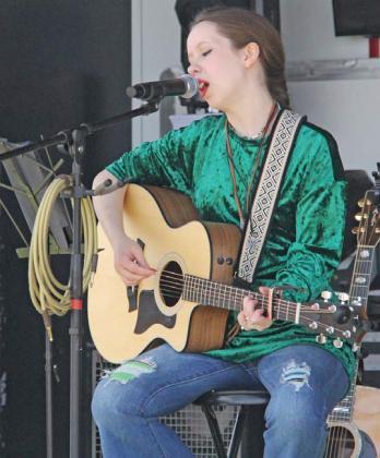 Singer/ Songwriter Ashton Jones performed for crowds during the St. Patrick's Day Festival. Wyndi Veigel-Gaudette | Citizen staff photo