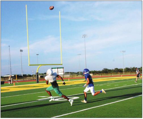 Dublin Lion Dalan Rasberry is pictured running to receive a ball in the end zone while avoiding opponent offense during a recent home scrimmage.
