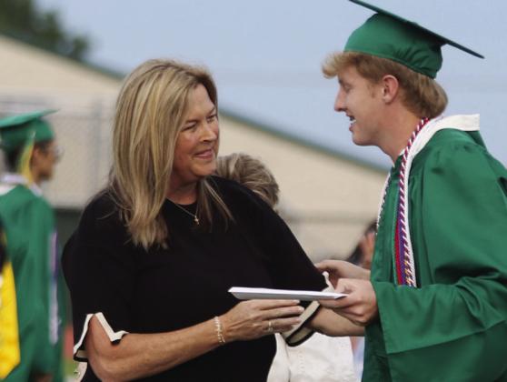 85 grads cross stage for new beginnings