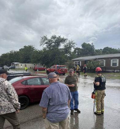 Officials and first responders prepare to evacuate Village Mobile Home Park in Stephenville due to swiftly rising waters Sunday, July 6. Brandon Huckabee | Courtesy photo