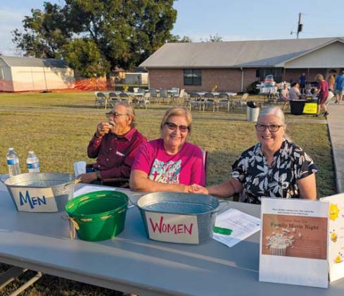 Community Baptist Church welcomes people to a Summer Social event Friday, July 26. The event showcased a wide range of door prizes, hot dogs and watermelon, along with music and family friendly games. Paul Gaudette | Citizen staff photo