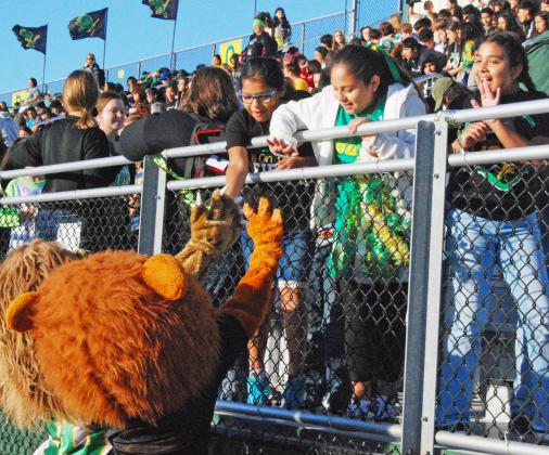 Dublin High School and Jr. High lion mascots join together at the pep rally to greet DISD students