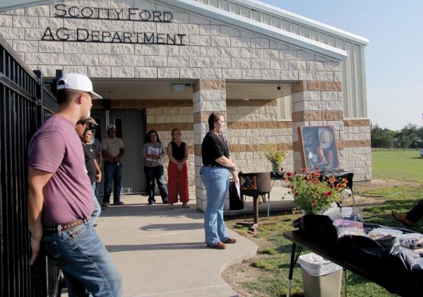 Lingleville Senior Skylah Finley read a speech on behalf of all ag students as the Lingleville ISD Ag Building is dedicated to the late ag teacher Scotty Ford who passed away in 2022.