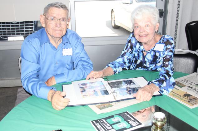 Jesse Weems and Delyn Alexander Spurgin of the Dublin High School Class of 1959 enjoyed looking at a picture album together at the Dublin Area Reunion June 10, 2023, at The Station.