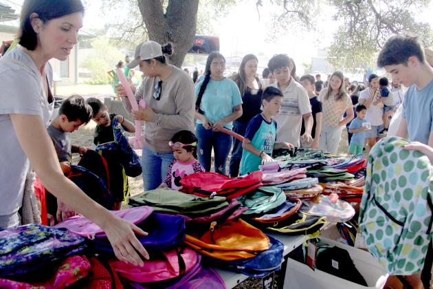Volunteers helped students pick out free backpacks at the Dublin Public Library’s Back-to-School Fair July 29, 2023. Though organized by the library, the community comes together each year to make sure students are ready for school and to ease the burden on families financially.