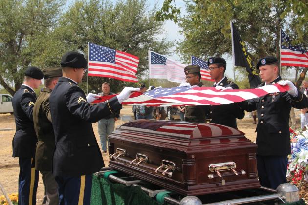 A flag is removed from the coffin of First Lt. Noel Shoup, a World War II veteran from Erath County, by the Honor Guard from Ft. Cavazos on Sept. 11, 2023. Shoup’s remains were recently returned to his family after more than 79 years.