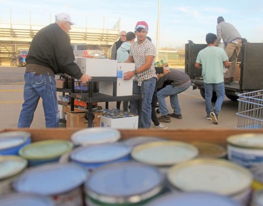 Dublin Goodfellows and First Methodist Church volunteers were joined by Dublin High School students in loading up 1,625 canned and boxed items gathered in the annual Dublin Elementary food drive in December 2023.