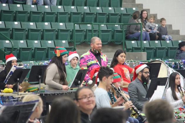 Band directors Ronny Luedke and Matt Asebedo got into the holiday spirit at the Christmas band concert Thursday, Dec. 14 along with their students. 