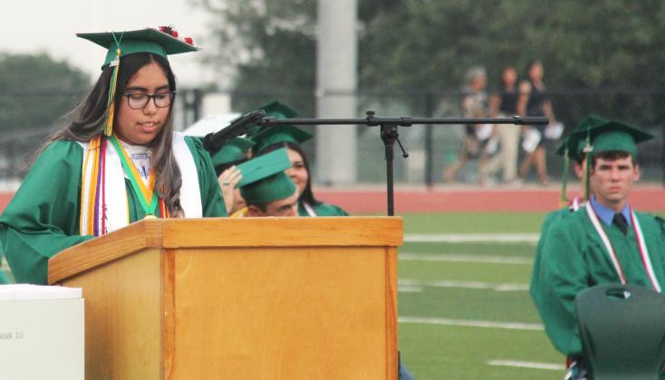 2024 Dublin High School Valedictorian Mariana Ortiz and salutatotorian Karina Ortega speak at the May 24 graduation ceremony while classmates pose for photos following commencement.