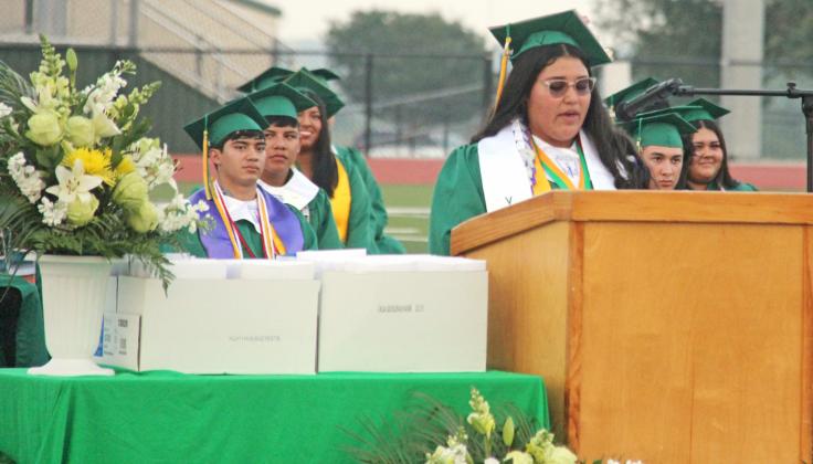 2024 Dublin High School Valedictorian Mariana Ortiz and salutatotorian Karina Ortega speak at the May 24 graduation ceremony while classmates pose for photos following commencement.
