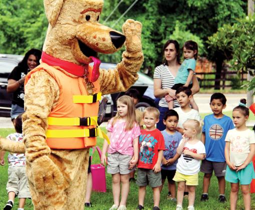 Bobber, the Water Safety Dog exhibits the proper way to wear a life vest to a crowd of more than 60 kids and parents during a water safety program at Dublin Public Library during the Summer Reading Program.