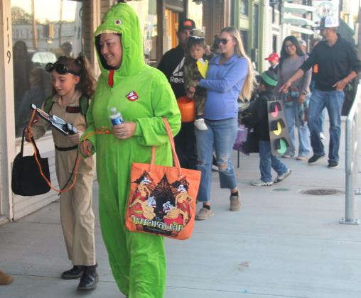 Hoards of eager Trick-or-Treaters collect candy and treats from local businesses and organizations during the Dublin Chamber of Commerce’s Safe Trick or Treat Oct. 31, 2024.