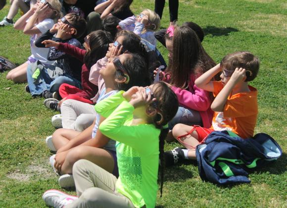 Dublin elementary students expressed awe and delight as they watched the total solar eclipse from the playground April 8, 2024. Throughout town people enjoyed watching the total solar eclipse including special events at the school district and at the Dublin Public Library.