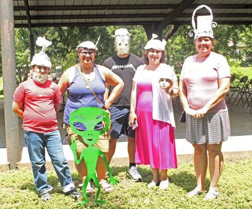 Winners of the tinfoil hat contest show off their best signal-blocking styles during an event in honor of the 133rd anniversary of a reported UFO explosion over the William T. Miller Grist Mill. The event was held June 15, 2024 alongside the monthly Dublin Market Day farmers market in Wright Park.
