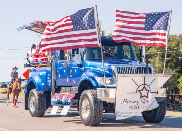 A patriotically adorned truck for Morning Star Ranch shows off their supporters followed by riders on horseback at Stephenville's July 4th parade. Morning Star Ranch is a safe, Christian experience where children can learn life skills by opening their hearts to horses located outside Dublin.
