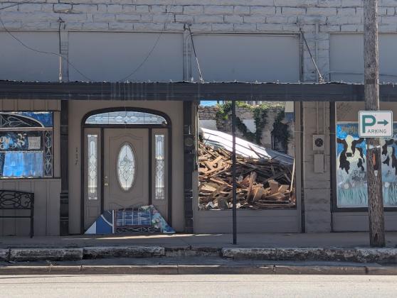 The roof of the building next to the Corner Lot collapsed in November 2024 leaving a pile of rubble for the owners to sort through and a demolition permit to remove the debris has been applied for.