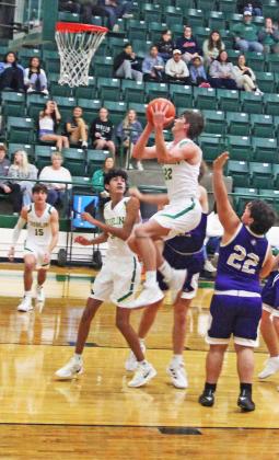 Dublin Lion Hunter Jones  springs up around San Saba defenders to score 2 points in the Nov. 25, 2024, home game which resulted in a win for the Lions.
