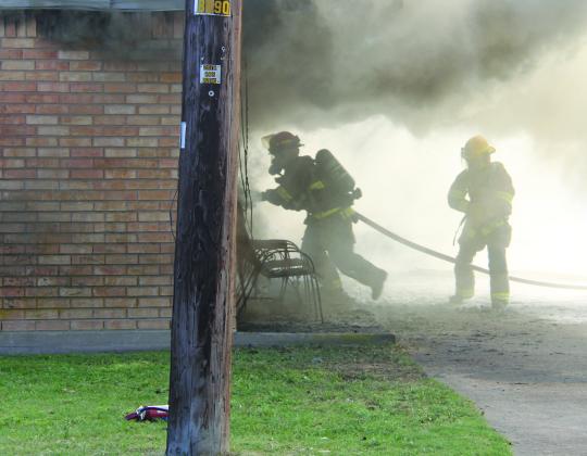 Firefighters battled their way through smoke to enter an apartment on Mesquite Street that was fully involved. As a result of the fire, Jackie Reed, 72, died in October 2024. Other nearby apartments were impacted through smoke and water damage.