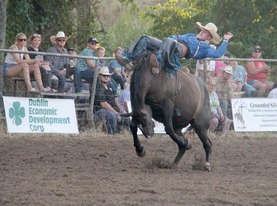 A cowboy holds on for dear life during the bronc riding event Aug. 17, 2024, at the 4th annual UPRA/CPRA sanctioned Dublin Rodeo hosted by Byrn Rodeo Productions.