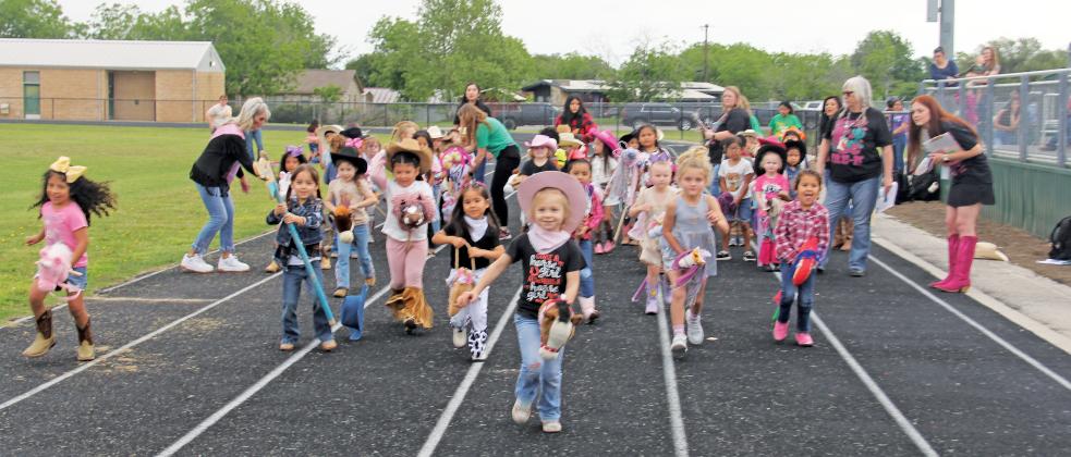 Students gallop down the track in a faulty start to race.