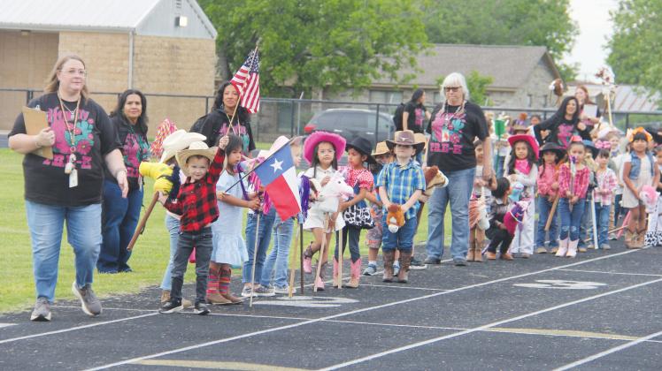 The Grand Entry starts its walk around the track.