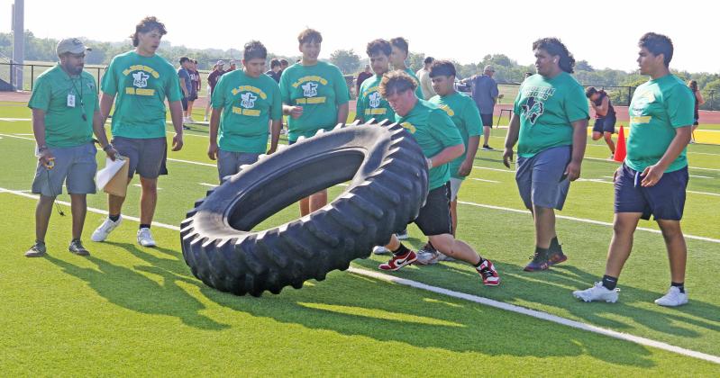 DHS Lions football players team up and encourage each other through events at the lineman challenge Thursday, May 29, which included pushing a truck, bench press and flipping a tire down field and back. The team is headed to state competition at Hardin-Simmons University June 21 but will first make an appearance at Comanche for a challenge tournament Thursday, June 5 at 6 p.m.